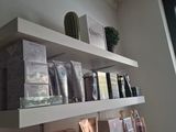 a shelf with various items on it in a room