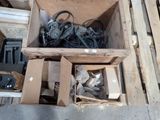 a box full of headphones and other items on the floor