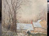 un tableau représentant une maison sous la neige, posé sur un chevalet