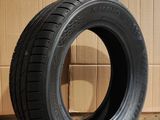 tire on the floor next to a cardboard box in a warehouse
