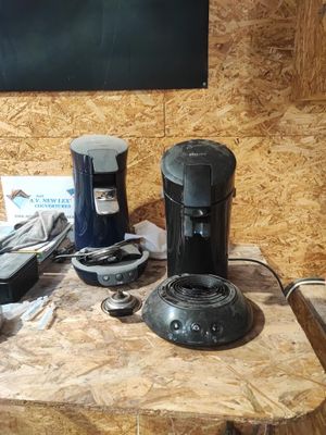a coffee maker and other items on a table