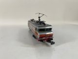 a toy train that is sitting on a white surface