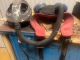 a blue cabinet with a pair of shoes and a mask on it