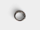 an image of a close up of a ring on a white surface