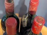 three bottles of wine that are sitting on a table