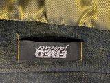 the label on the back of a yellow and black jacket