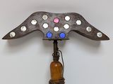 a metal object that has a bottle attached to it