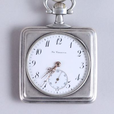 a silver pocket watch with a white face on a chain