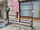 a pink flag on a pole outside of a building