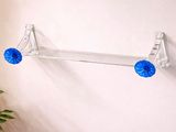 a glass shelf with a blue ball on it