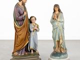 two figurines of jesus and mary with a child