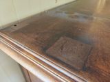 a close up of a wooden table with a glass top