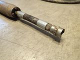a metal pipe that is laying on the floor