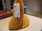 a pillow that looks like a banana on a mattress