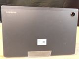a laptop that is sitting on a wooden table