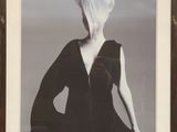 an image of a black and white photo of a woman in a black dress