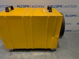 a yellow plastic box with wheels on a metal surface
