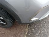 a close up of a car ' s tire on the street