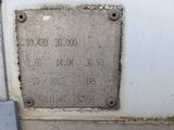 a metal plaque on the side of a white truck