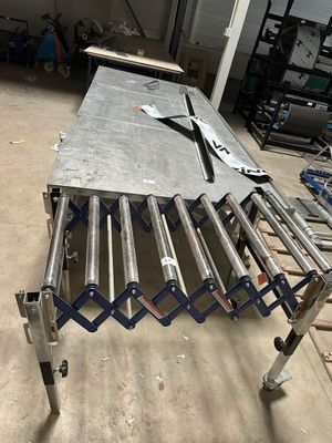 a table that has a bunch of metal pipes on it