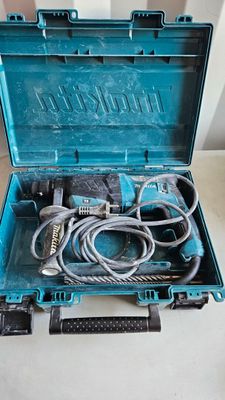 a blue tool box with a corded cord in it