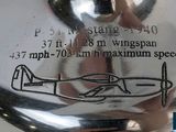 a close up of a silver plate with a drawing on it