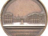 an image of a bronze medal with a picture of a building in the background