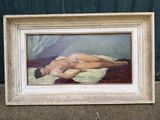 tableau représentant une femme allongée sur un lit, dans un cadre blanc
