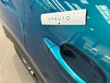 a sticker on the door handle of a blue car