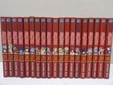 the seven books are lined up in a row on a white surface