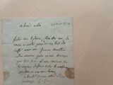 a piece of paper with writing on it sitting on a table