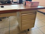 a desk with drawers and a computer mouse on top of it