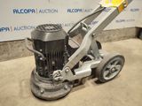 an image of a concrete floor polisher in a garage