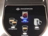 a close up of a coffee maker on a table
