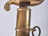 a close up of a sword with a gold handle