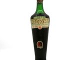 an image of a bottle of liquor sitting on top of a white surface