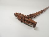 an image of a wooden stick with a wooden handle on a white surface