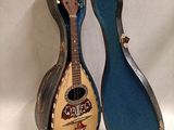 a guitar that is sitting in a case on a table