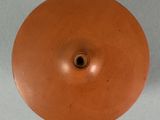 a brown vase that has a hole in the middle of it