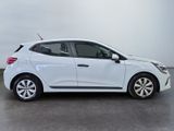 a white car is parked in a large room with a gray floor