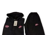 a black hoodie and sweat pants with a pink nike logo