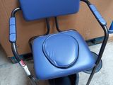 a blue chair with a blue seat on the floor