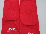 a pair of red knee pads with white logos on them
