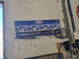 a picture of a sign on a wall in a garage