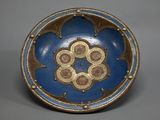 blue and brown plate with a decorative design on the outside