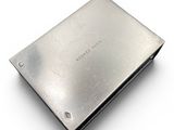 a metal plate that is sitting on a white surface