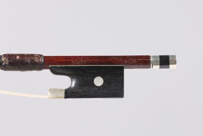 a violin bow with a wooden handle on a white background
