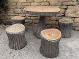 several pieces of wood are stacked on top of each other on the ground