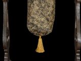 an image of a wooden chair with a tassel hanging from it ' s back