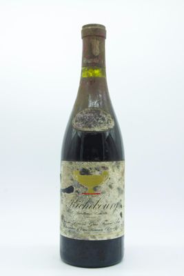 a bottle of wine that is sitting on a table